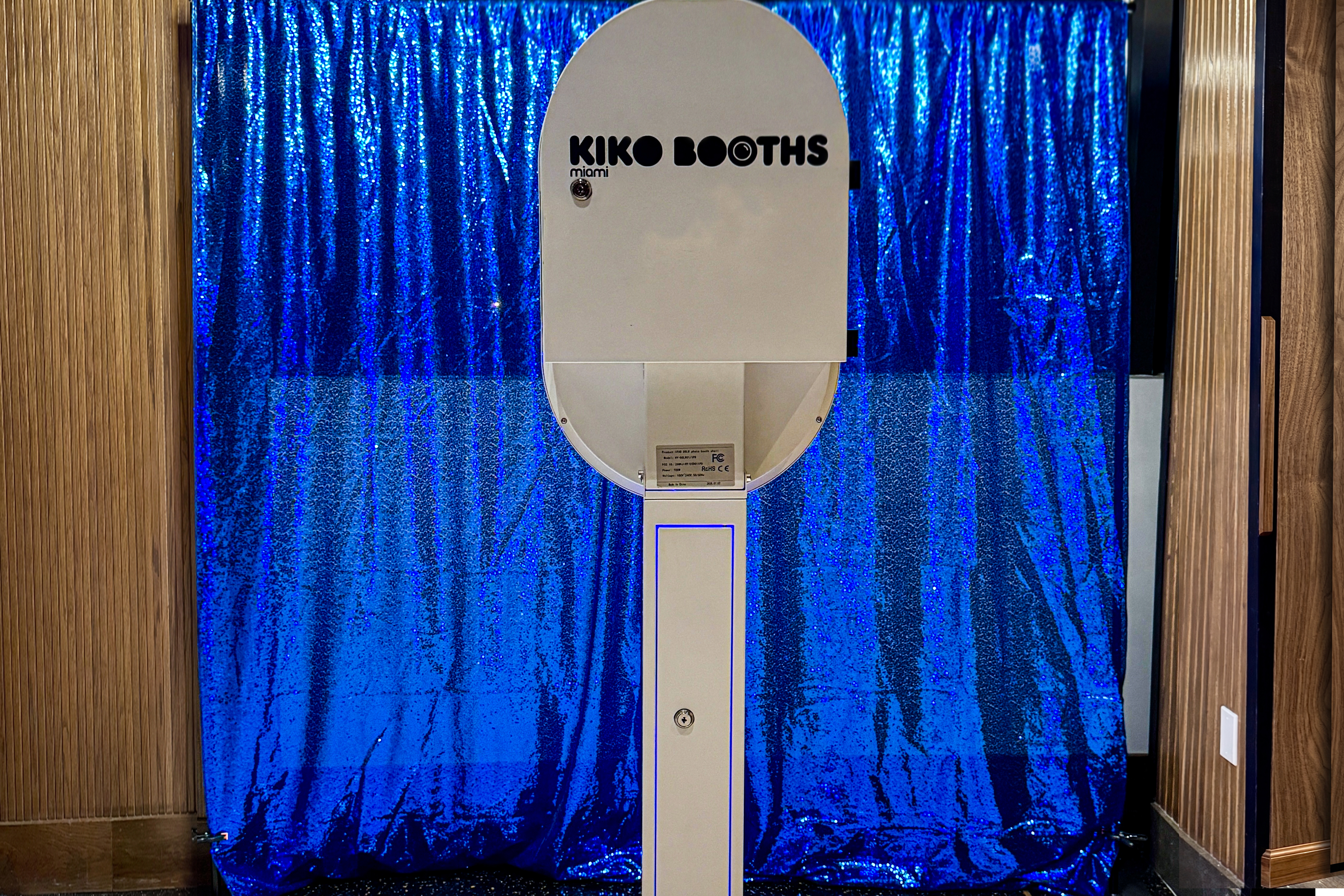 ARO photobooth set up with a blue sequin backdrop at a Miami event venue